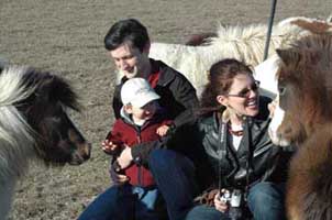 Lisa, Bryan and Grayson with horses in 2005